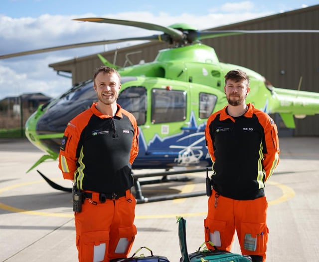 MP walks on fire for air ambulance