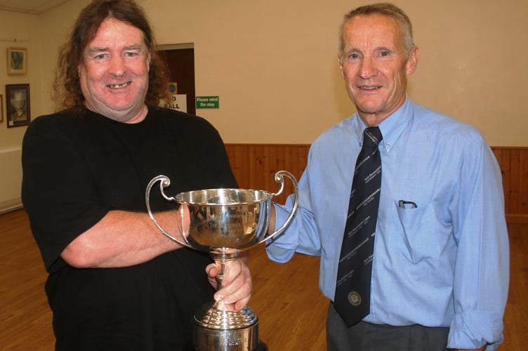 Steve Stacey, the secretary of Howle Hill FC, accepted the Fletcher Cup for Sportsmanship on behalf of the club from Clive Wilkes.