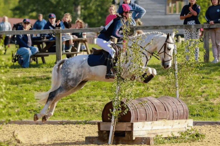 A Haberdashers' Monmouth rider clears the next obstacle