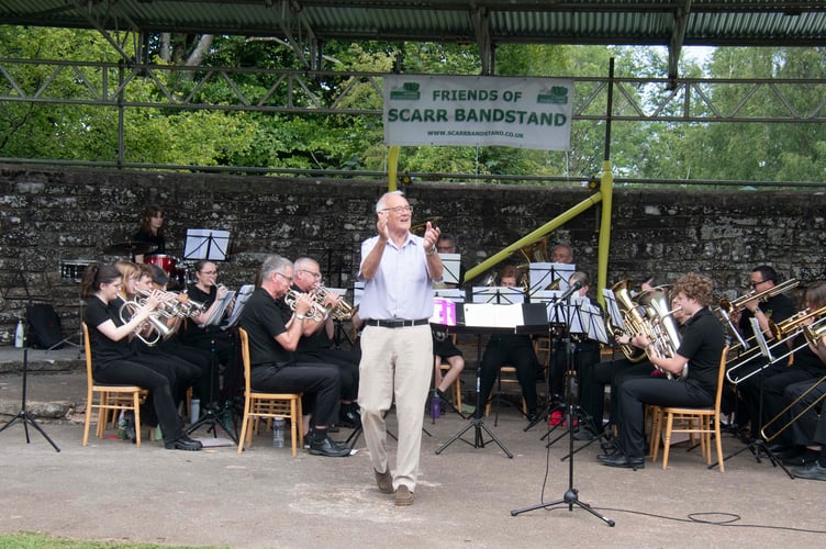 Lydbrook conductor Robert Morgan encourages some audience participation.