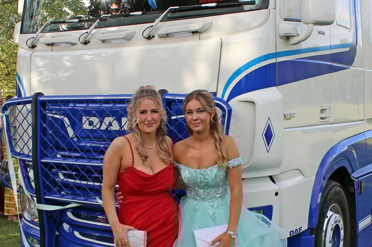 Bailey Ward and Sofi Brooks with one of the larger vehicles.