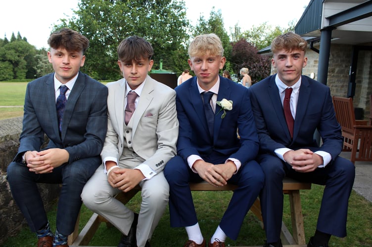Four of the young men at the prom.
