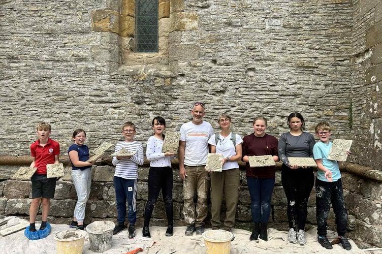 Ben Kerslate with pupils and staff from Westbury School at the church.