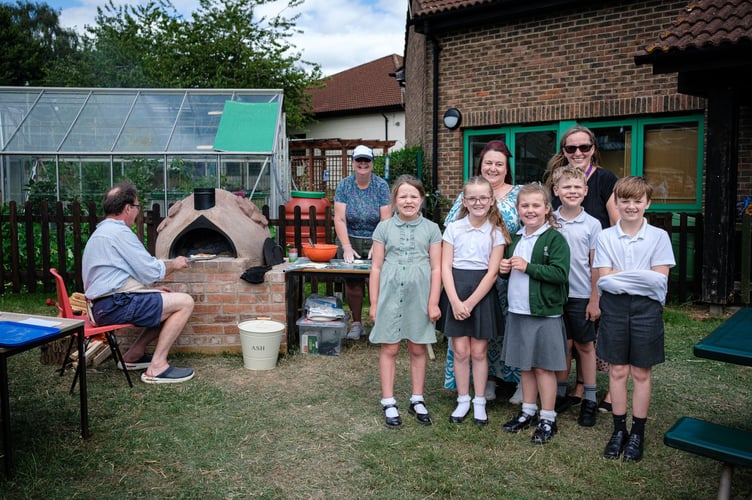 Mayor of Lydney Natasha Saunders (left) and headteacher Emma Mignaud with pupils.