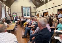 Packed meeting hears opposition to housing plans