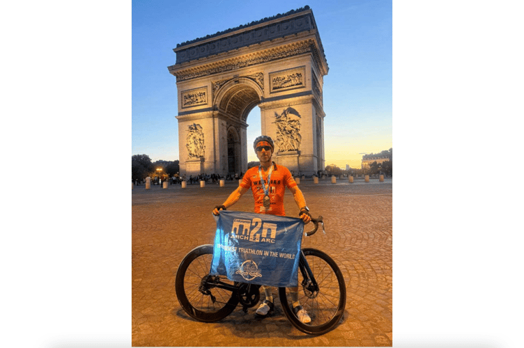 Sam Weale in front of the Arc de Triomphe after completing his epic challenge. Photo: Sam Weale