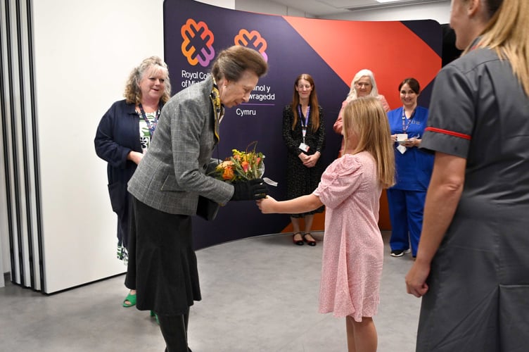 HRH The Princess Royal receiving flowers from Lowri Griffiths, age 9 - child of staff member Ellie Griffiths