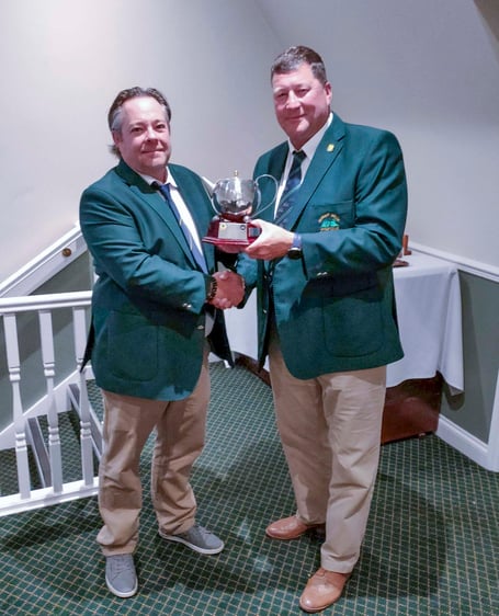 Duncan Buchanan (left, of the Forest of Dean club )receivies the Mo Pearce Tee Pot Trophy from Mark Graham.