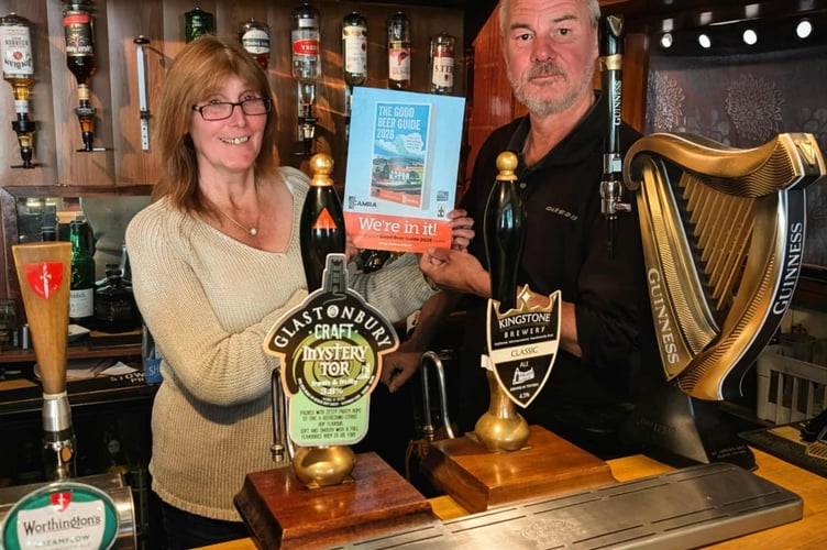 Suzanne and Mike Harvey of The White Horse, Soudley with a copy of the new guide.