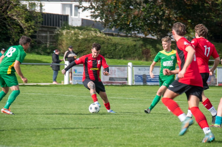 Milkwall goalscorer Ollie Fitt on the ball.