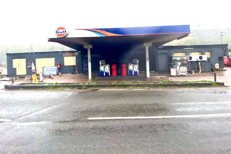 The windows have been boarded up at the fire-hit Bishopswood petrol station