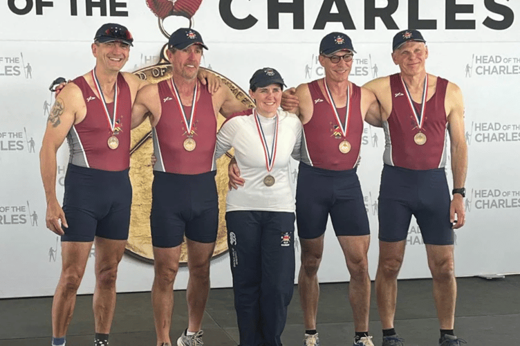 The Monmouth RC four celebrate the first ever win by a Welsh club in the world's biggest rowing race, the Head of the Charles
