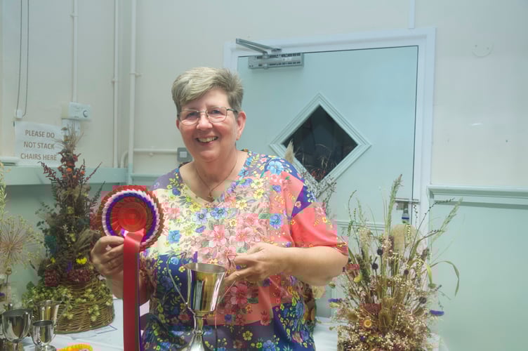 Trudy Breadman won the horticulture;cup for best in show with her basket of produce.