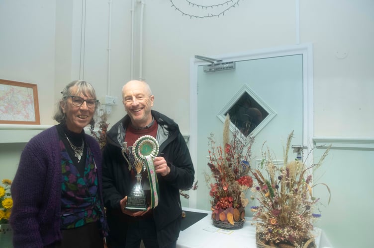 Show president Diana Standing presented the HJ Preest Cup for best chrysanthemum to John Snowden
