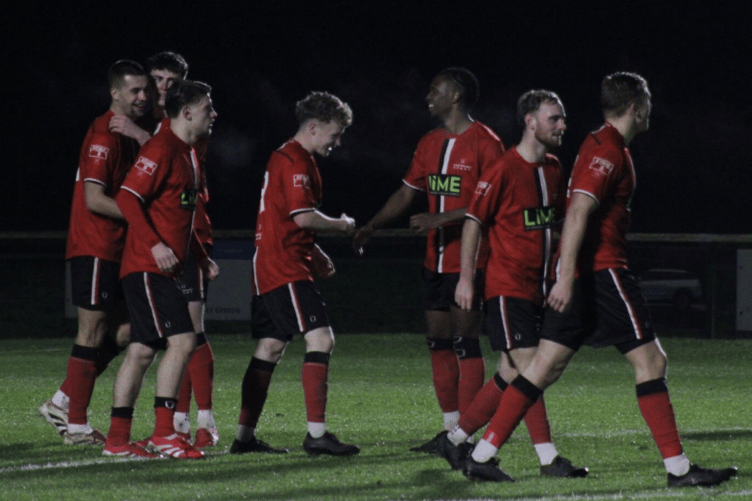 Hartpury FC players rejoice after one of their six goals against Tavistock AFC.