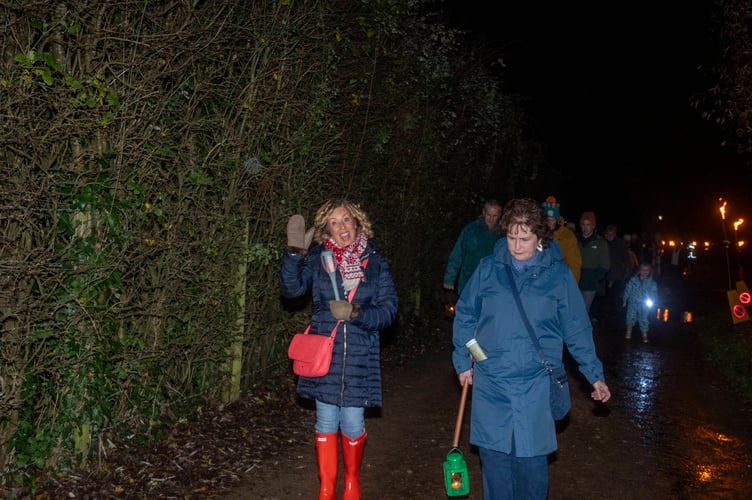 A wave from one of the walkers