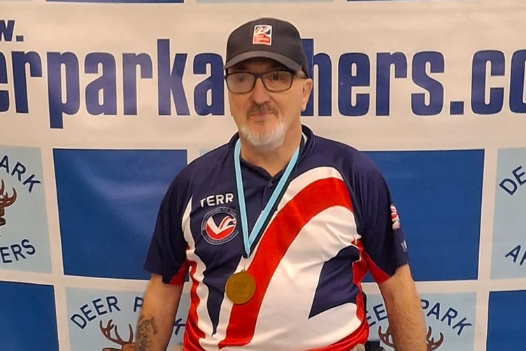 Terry Piper with his medal after breaking his British Blind Sports archery record at the Deer Park Archers event.