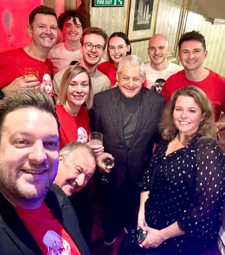 Dominic Callaghan, in red right of Les Miserables impresario Cameron Mackintosh, at the after-show party