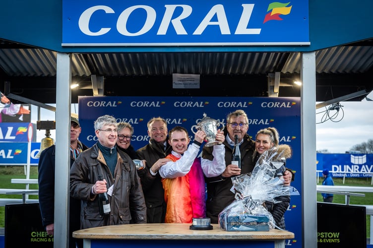 Sean Bowen lifts the Welsh Grand National Trophy 