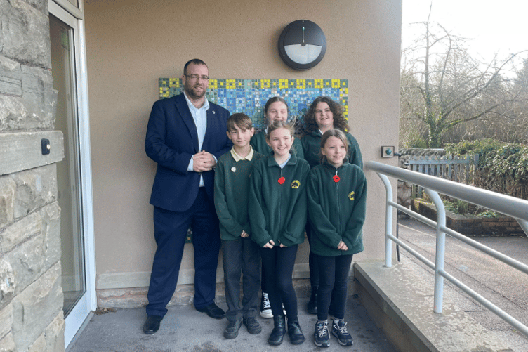 WELCOME: Matt Bishop MP pictured with pupils outside Parkend Primary School.