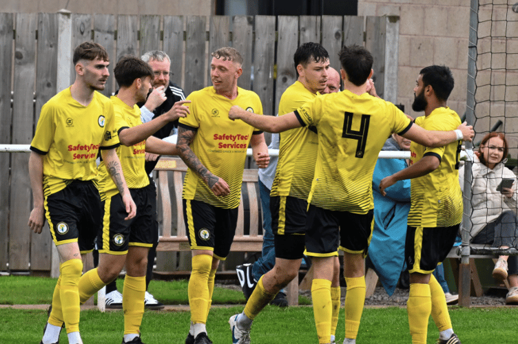 Newent Town players celebrate one of the goals during their 4 0 away victory over Clanfield 85 at Radcot Road.