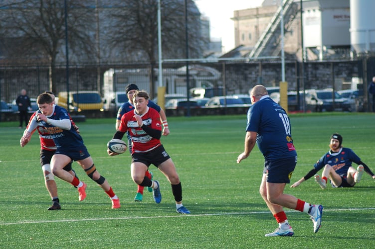 Lydney were beaten 40–16 by league leaders Devonport Services on an artificial surface in Devon.