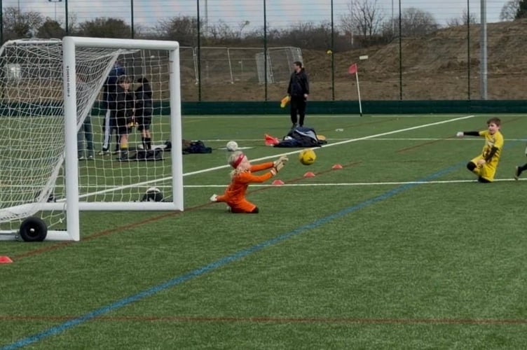 Broadwell goalkeeper Hugo Sherry with one of many excellent saves.