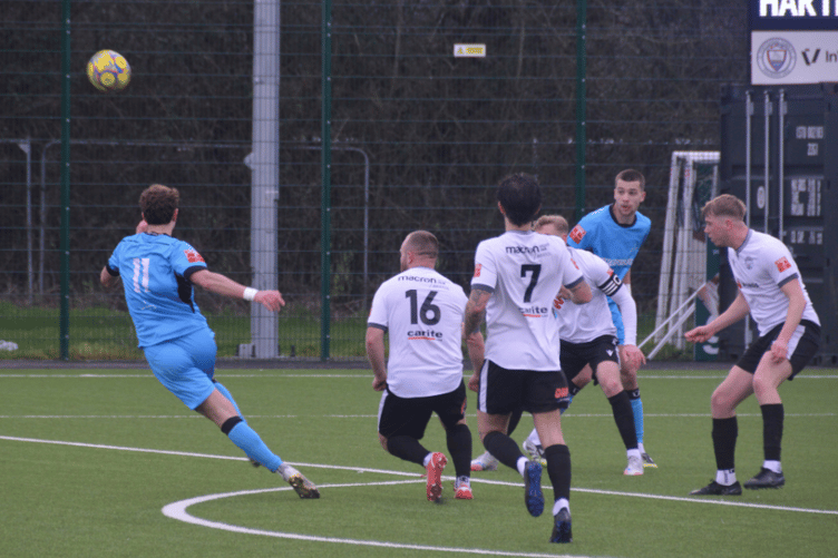 Hartpury FC in play during their 3 1 victory over Portishead Town, maintaining their winning streak.