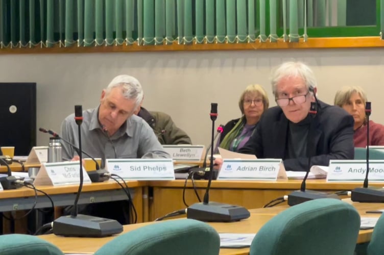 Adrian Birch (right) speaking during the no confidence debate.