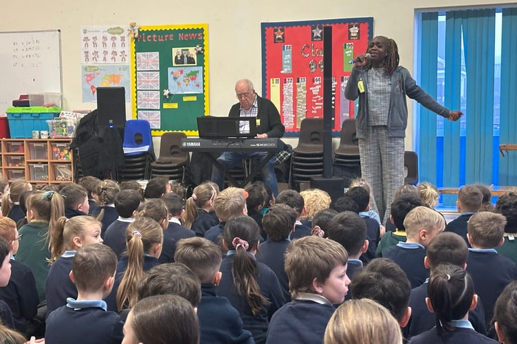 Musician Onika Venus performs at the assembly.