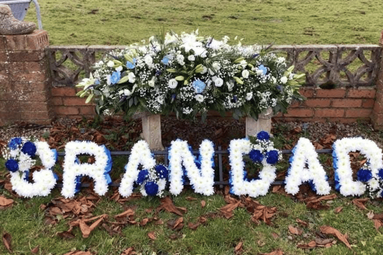 A bespoke funeral flower arrangement, carefully crafted to reflect personal memories and individual interests.