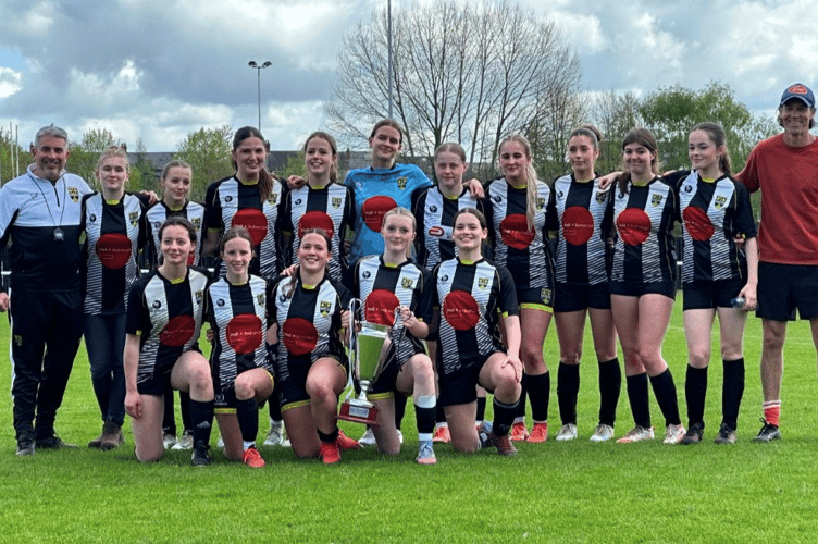 Lydney Town AFC U18 Lionesses celebrate with the trophy after securing the Bristol Girls League Division B title in a dominant end to their unbeaten season.