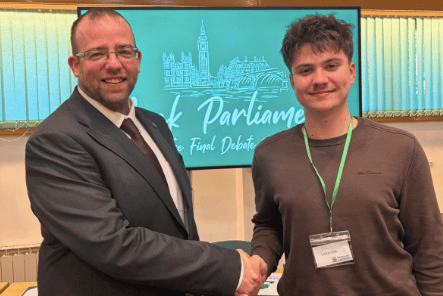 Matt Bishop MP pictured with a student during the Mock Parliament 2026 event.