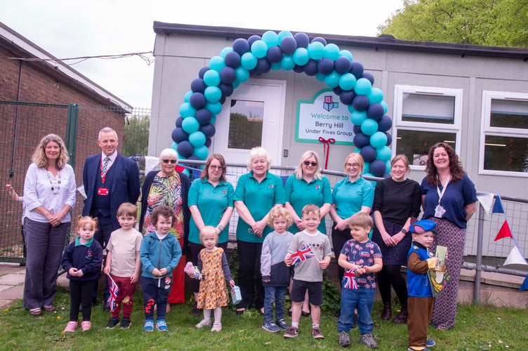 Former Chair Jo Revill, head of Five Acres high Simon Phelps, supporter Dot Sharp, playgroup assistant Shannon Davis, manager Margaret Bevan,  deputy manager Jennifer Kennedy,, playgroup assistant Shaunna Lloyd, Lynsey Hawkins lead at Berry Hill Primary and acting head of the school Michaela Reid with some of the children.