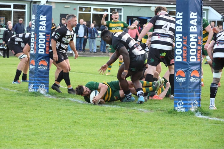Tom Webb scores for Newent. Picture: Georgina Gardner.