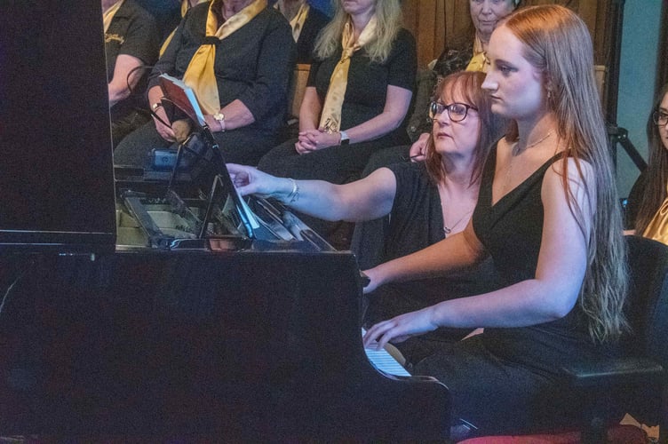 May D'Arcy plays a Hadyn piano sonata assisted by Tracey Gwynn.