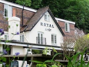 Riverside hotel hit by falling boulder from rock face