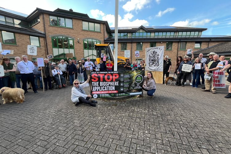 Supporters of a "pause" in the bid for Biosphere status outside the Forest Council offices before the meeting.