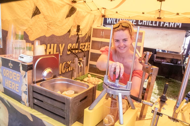 Jessica Roberts squeezing lemons for refreshing lemonade.