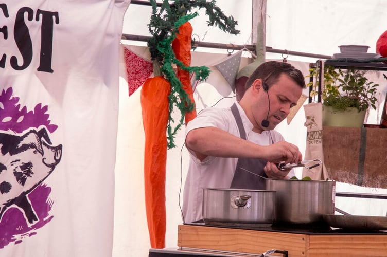 Aaron Christopher of the Tudor Farmhouse Hotel in Clearwell grates nutmeg into spinach.