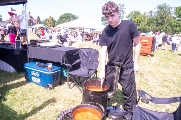 Taran Roberts of The Meat Hut in Longhope preparing an American cowboy bean mixture.