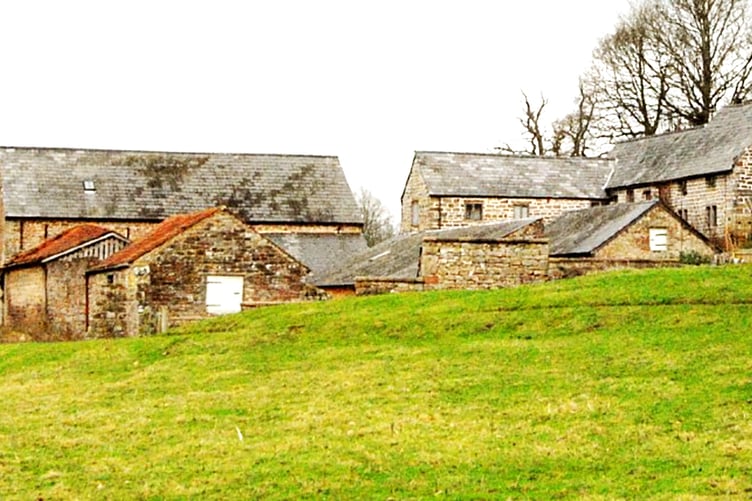 The owner of Mainoaks Cottage Barn, far left, has been told to remove solar panels from the roof and return it back to its original state, as pictured.