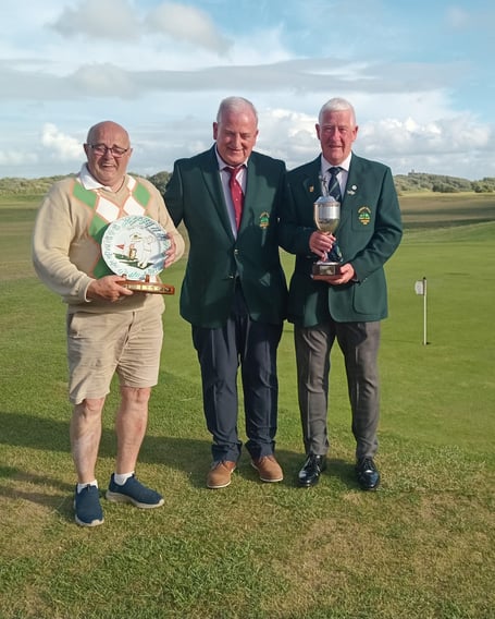 Glyn Earle, with The Best Endeavour Trophy, Seniors Captain Kev Doyle and Roger Hall with The Roy Powell Away Day Trophy.