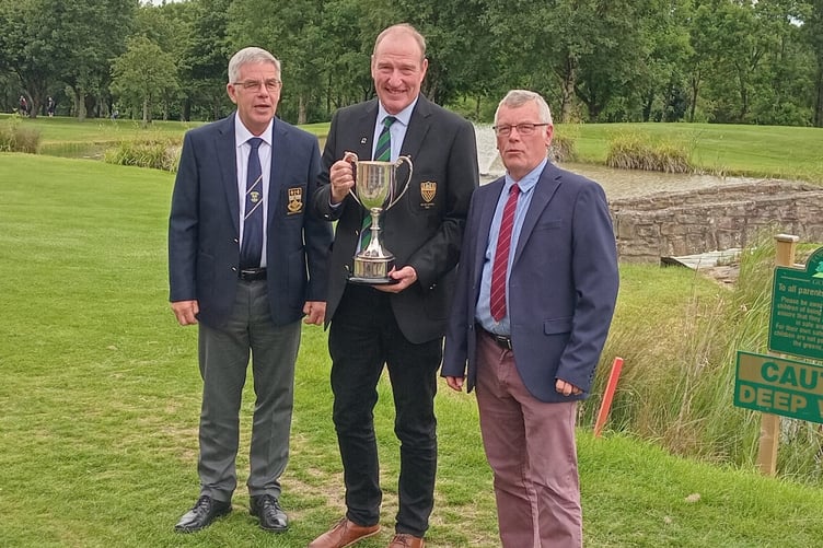Ade Carter of Lydney, Jerry Bolster ofForest of Dean with the Seniors’ Triangular Trophy, and Kev Greening of Forest Hills.