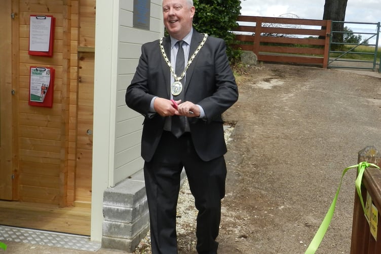 Mayor of Coleford Cllr Nick Penny cuts the ribbon to declare the pavilion open.