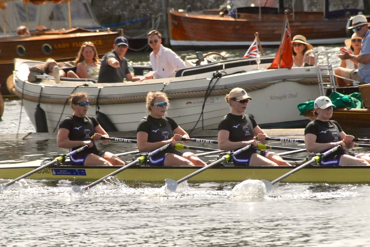 Fliss Cox, left, races to victory in her Reading University boat
