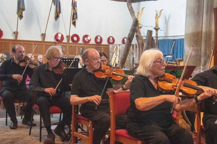 Orchestra leader Ros Taunton (right) with part of the string section