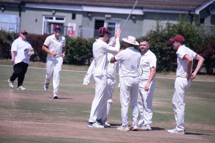 Lydney players celebrate after Kevin McDelling takes a catch