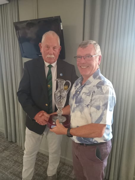 Dave Donoghue presenting the Dean Hills Trophy to Kevin Greening.