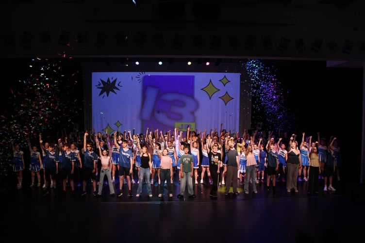 Whole cast at 13 JR the musical performed by lower school at MCS.